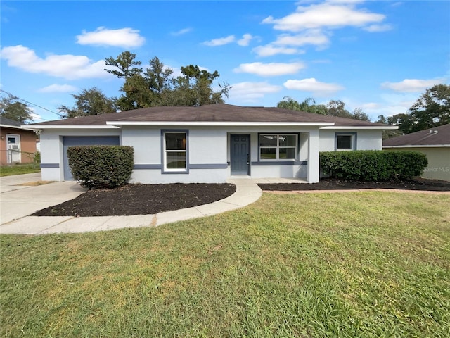 single story home with a garage and a front lawn