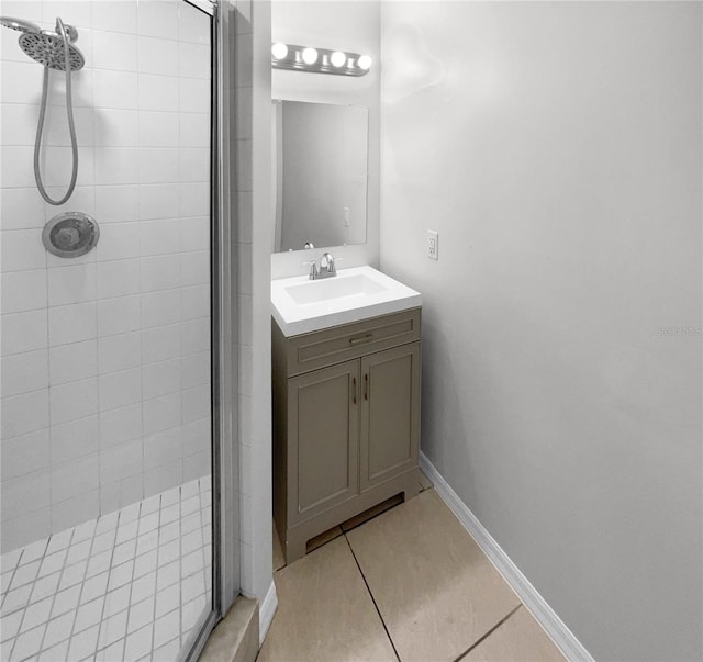 bathroom featuring vanity, tile patterned floors, and a shower with door