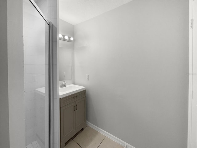 bathroom with vanity, tile patterned floors, and a shower with shower door