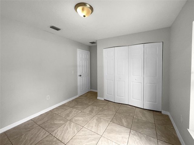 unfurnished bedroom featuring a closet