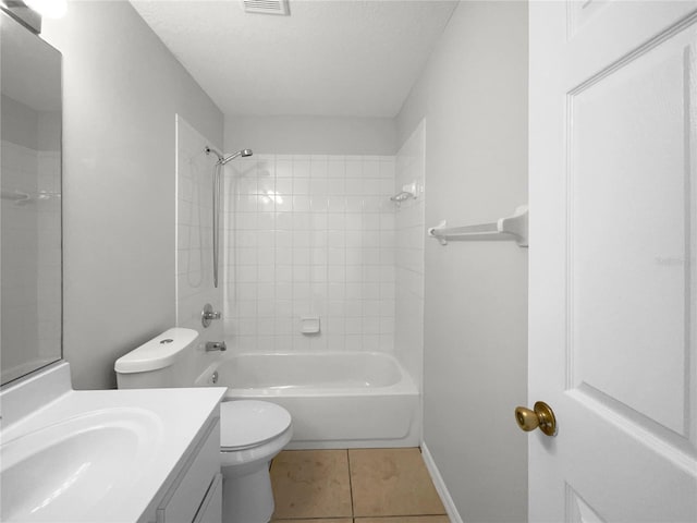 full bathroom with vanity, a textured ceiling, tile patterned flooring, toilet, and tiled shower / bath