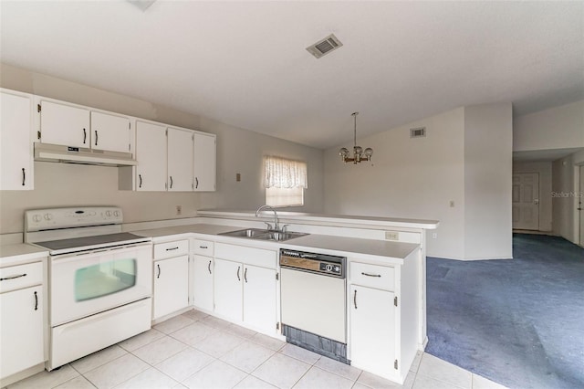 kitchen with white appliances, sink, decorative light fixtures, white cabinets, and lofted ceiling