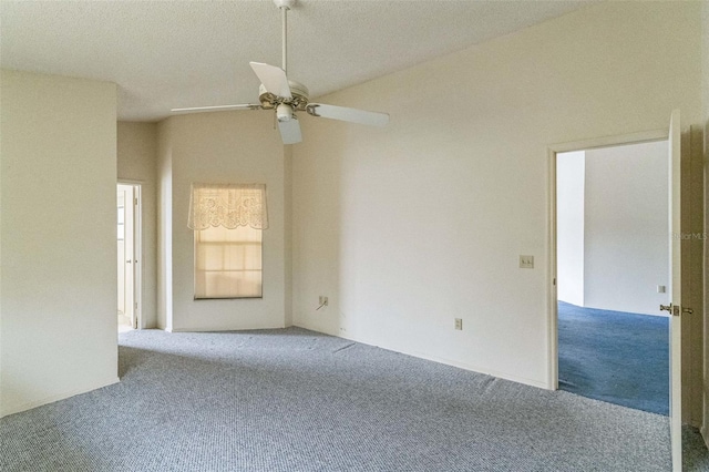 carpeted spare room with a textured ceiling and ceiling fan