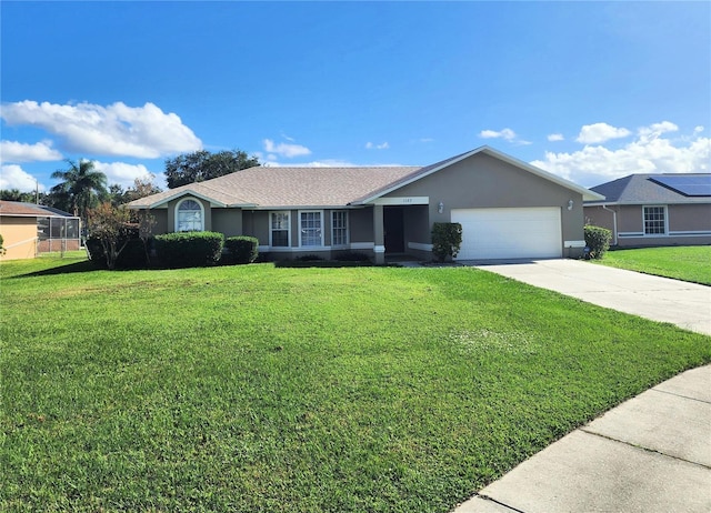 single story home featuring a garage and a front yard