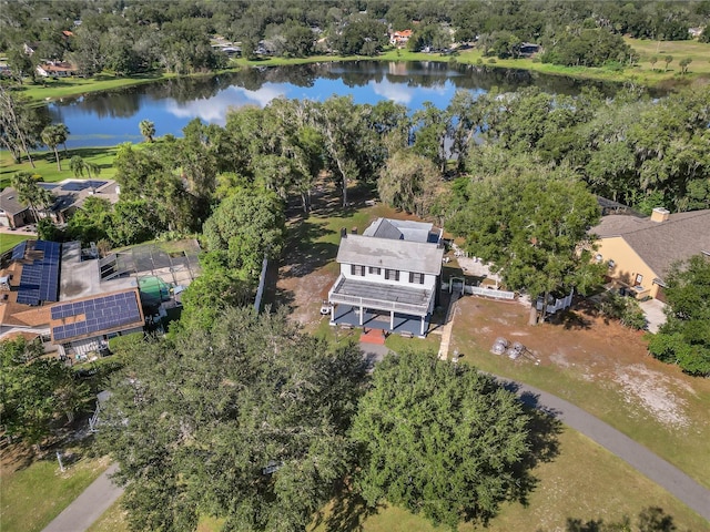 birds eye view of property with a water view