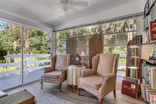 sunroom / solarium with ceiling fan and a healthy amount of sunlight