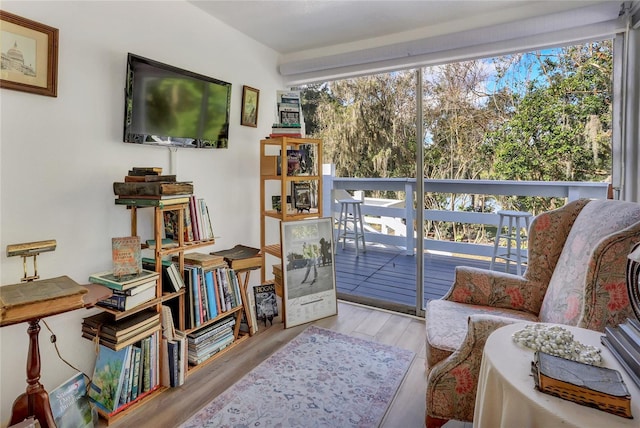 sitting room with light hardwood / wood-style floors and a healthy amount of sunlight