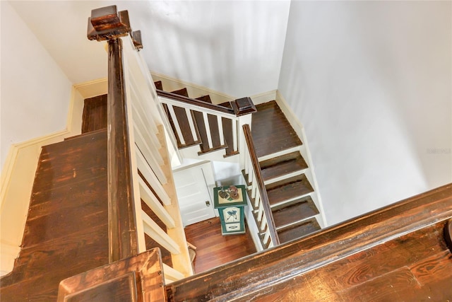 staircase with wood-type flooring