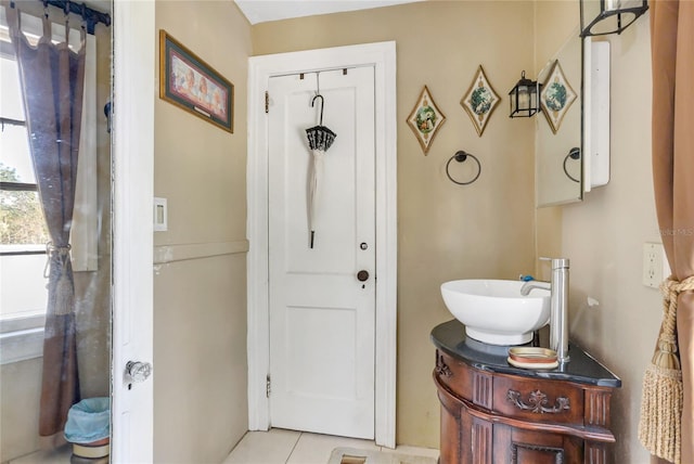 bathroom featuring vanity and tile patterned flooring