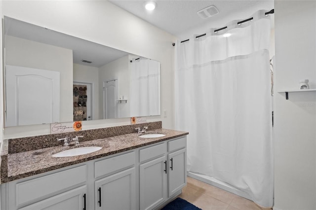 bathroom featuring vanity, tile patterned flooring, and a shower with shower curtain