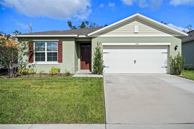 single story home with a garage and a front yard