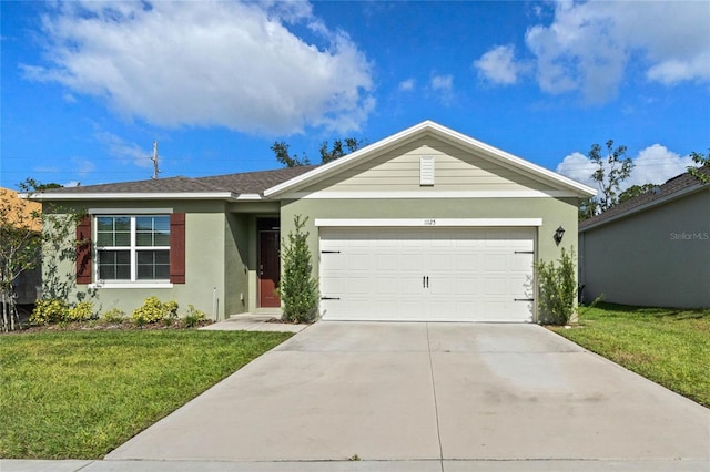 ranch-style home featuring a garage and a front yard