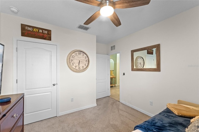 interior space with ceiling fan