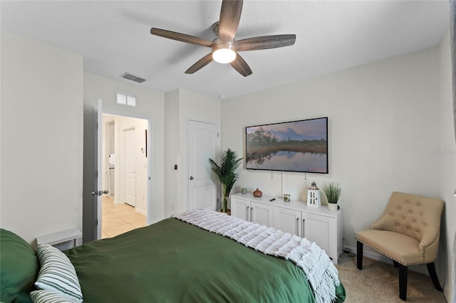 bedroom featuring light colored carpet and ceiling fan