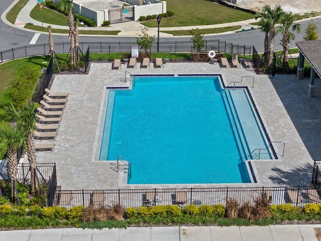 view of swimming pool featuring a patio area