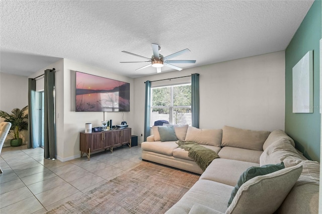 living room with light tile patterned floors, a textured ceiling, and ceiling fan