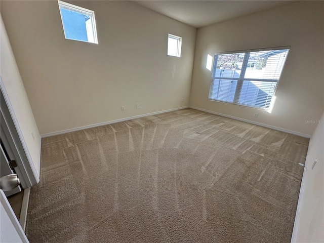 spare room featuring carpet floors