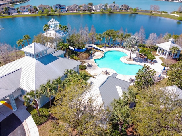 birds eye view of property featuring a water view and a residential view