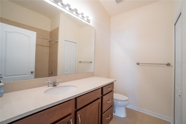 full bathroom with toilet, vanity, baseboards, tile patterned floors, and walk in shower