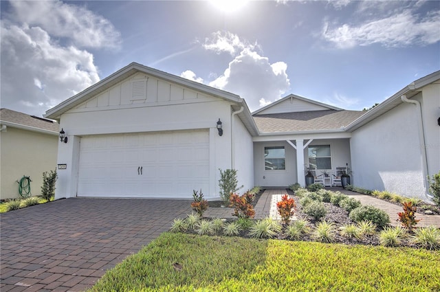 ranch-style house featuring a garage