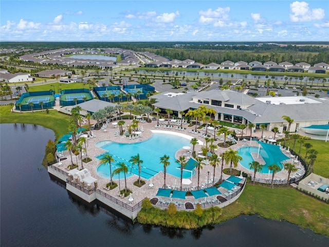 birds eye view of property with a water view