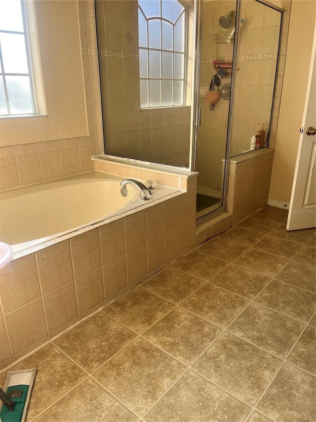 bathroom featuring plus walk in shower and tile patterned floors