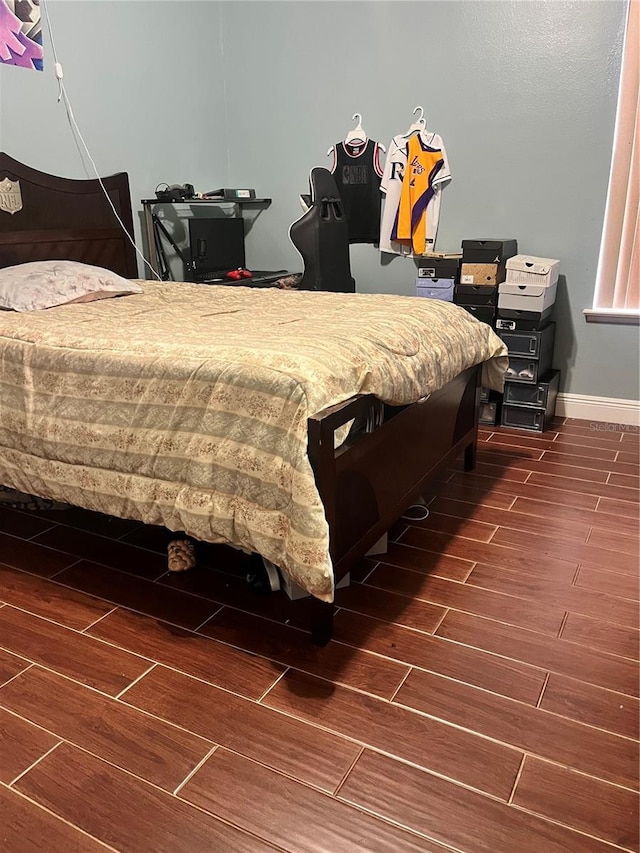 bedroom featuring dark wood-type flooring