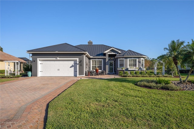 ranch-style house featuring a garage and a front yard