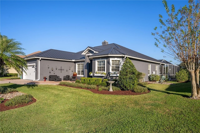 ranch-style house featuring a garage and a front lawn