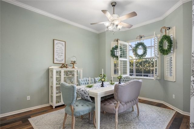 dining room with ceiling fan, dark hardwood / wood-style floors, and ornamental molding