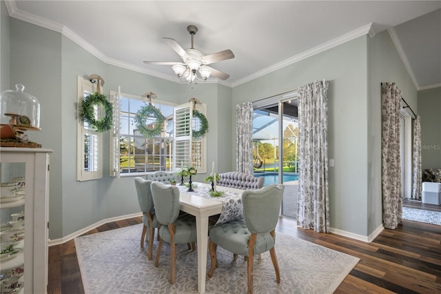 dining room with ceiling fan, ornamental molding, and dark wood-type flooring