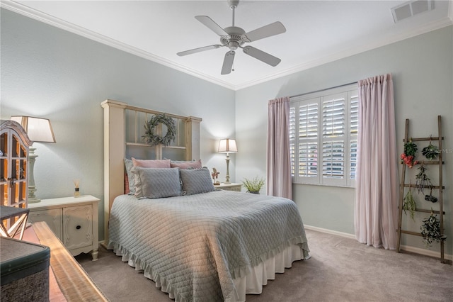 bedroom with ceiling fan, ornamental molding, and carpet floors