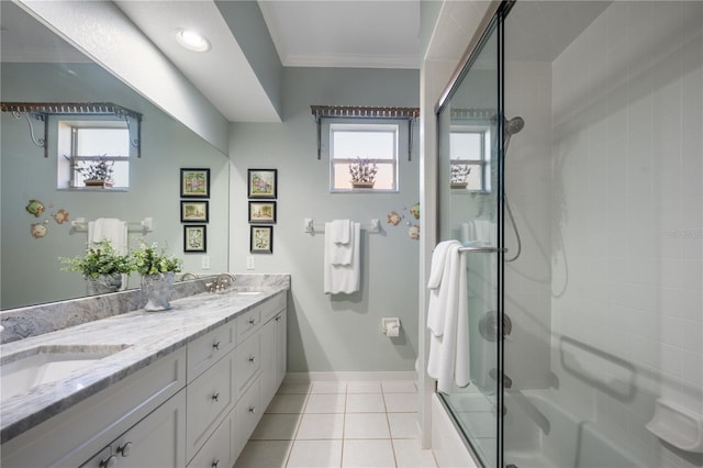 bathroom featuring crown molding, tile patterned flooring, vanity, and combined bath / shower with glass door