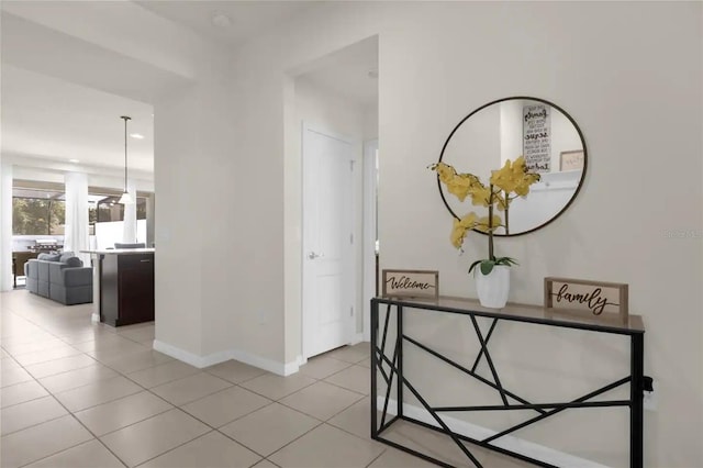 hall featuring light tile patterned flooring