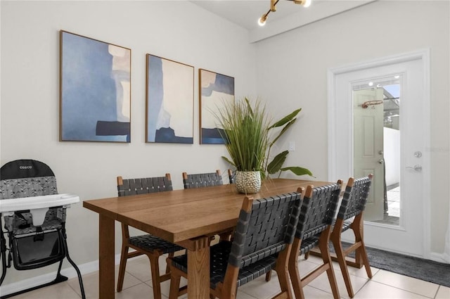 dining space with light tile patterned floors