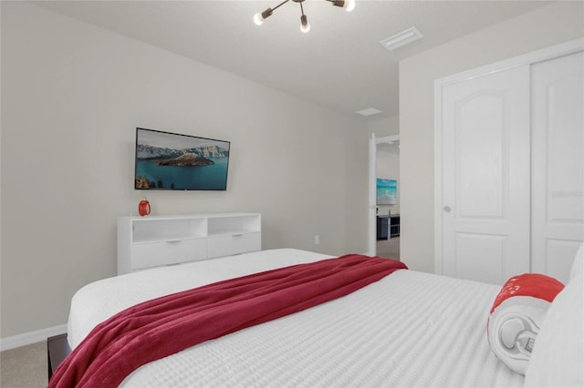 carpeted bedroom featuring a closet