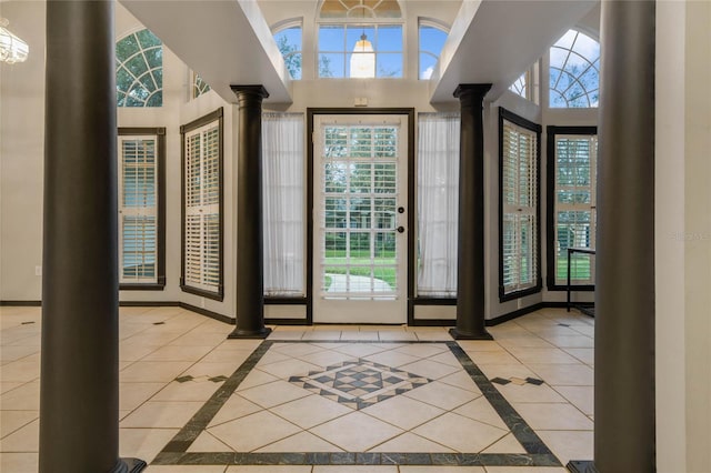 tiled foyer entrance featuring ornate columns