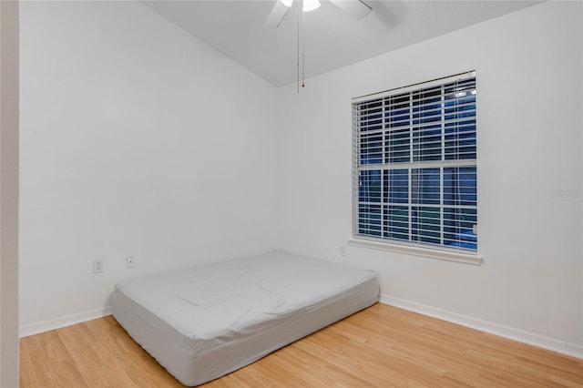 unfurnished bedroom featuring ceiling fan and wood-type flooring