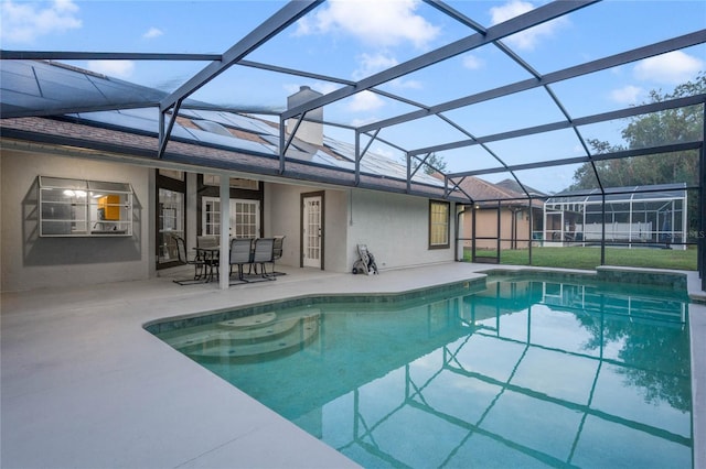 view of pool featuring a lanai and a patio area