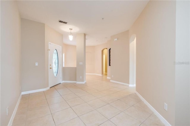 spare room featuring light tile patterned floors