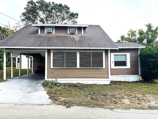 view of front of property featuring a carport