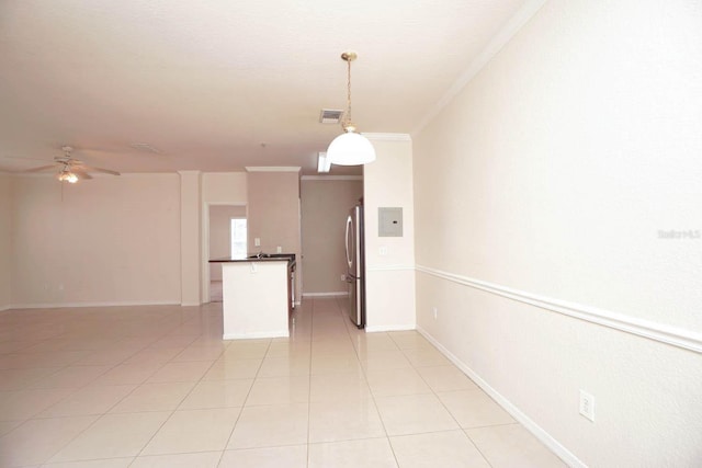 interior space with ceiling fan and ornamental molding