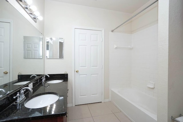 bathroom with  shower combination, tile patterned floors, and vanity