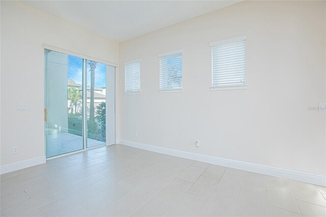 empty room featuring light tile patterned floors