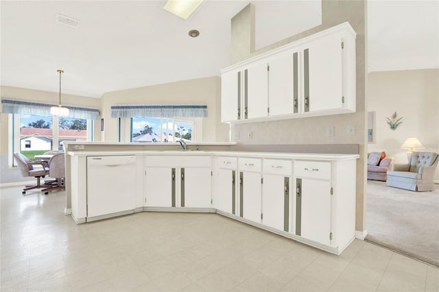 kitchen featuring decorative light fixtures, light colored carpet, lofted ceiling, dishwasher, and white cabinets