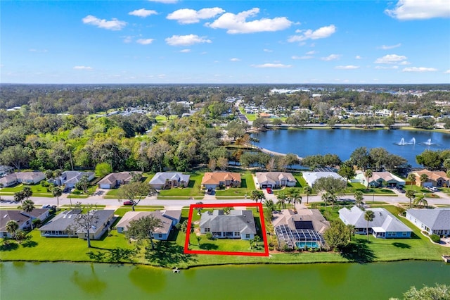 birds eye view of property with a water view