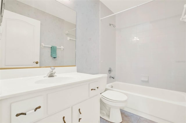 full bathroom featuring tile patterned floors, tiled shower / bath combo, vanity, and toilet