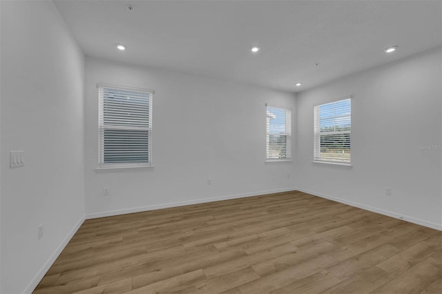 spare room featuring light hardwood / wood-style floors