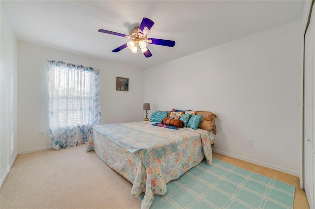 bedroom with ceiling fan and carpet floors