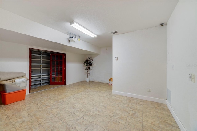 interior space featuring a textured ceiling